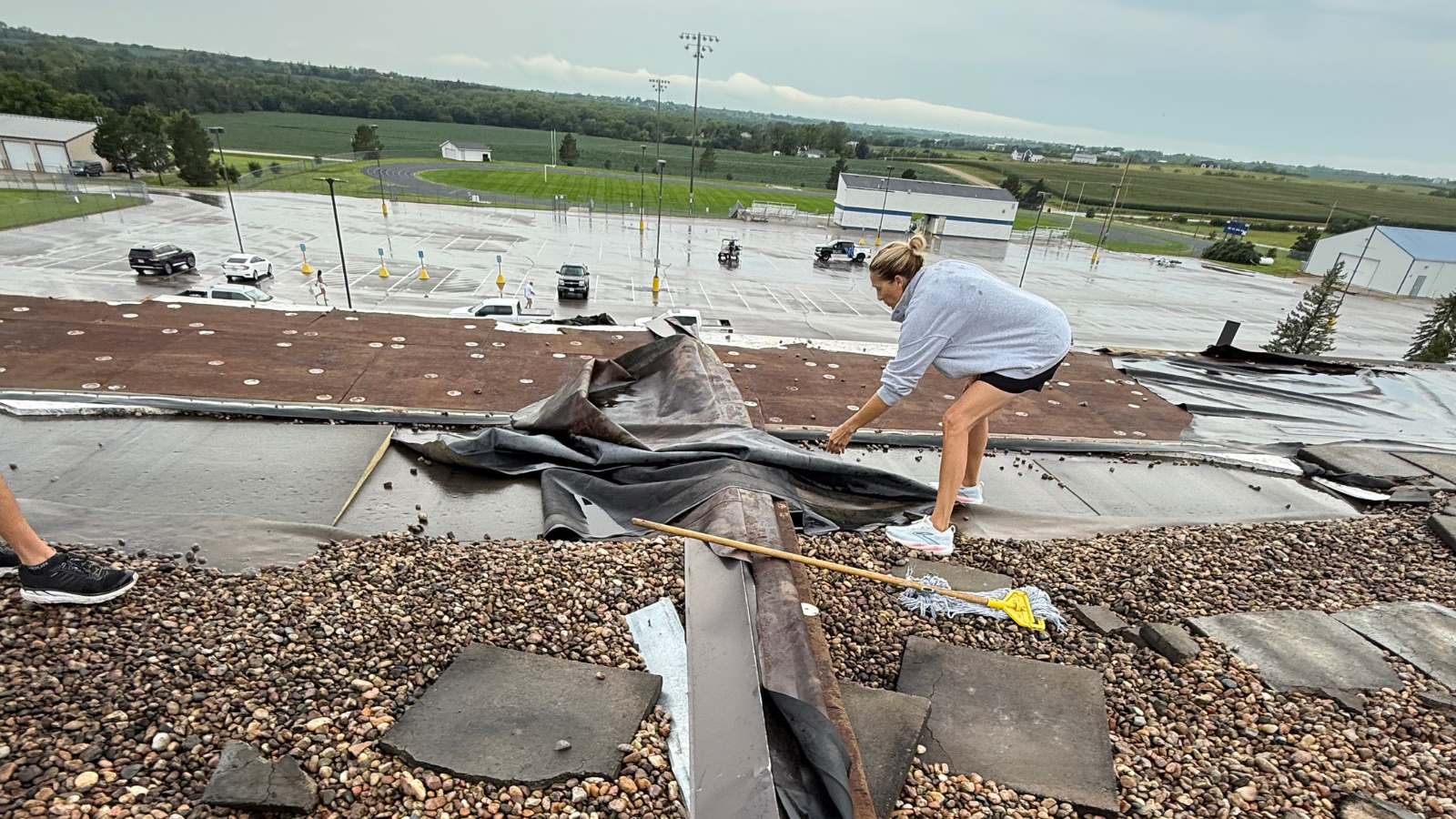 Malcolm community helps clean up storm damage to high school's gym and athletic facilities